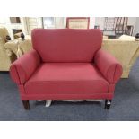 An Edwardian two seater settee in red fabric