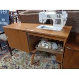 A New Home teak cased sewing machine table
