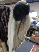 A white fox fur coat,