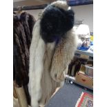 A white fox fur coat,