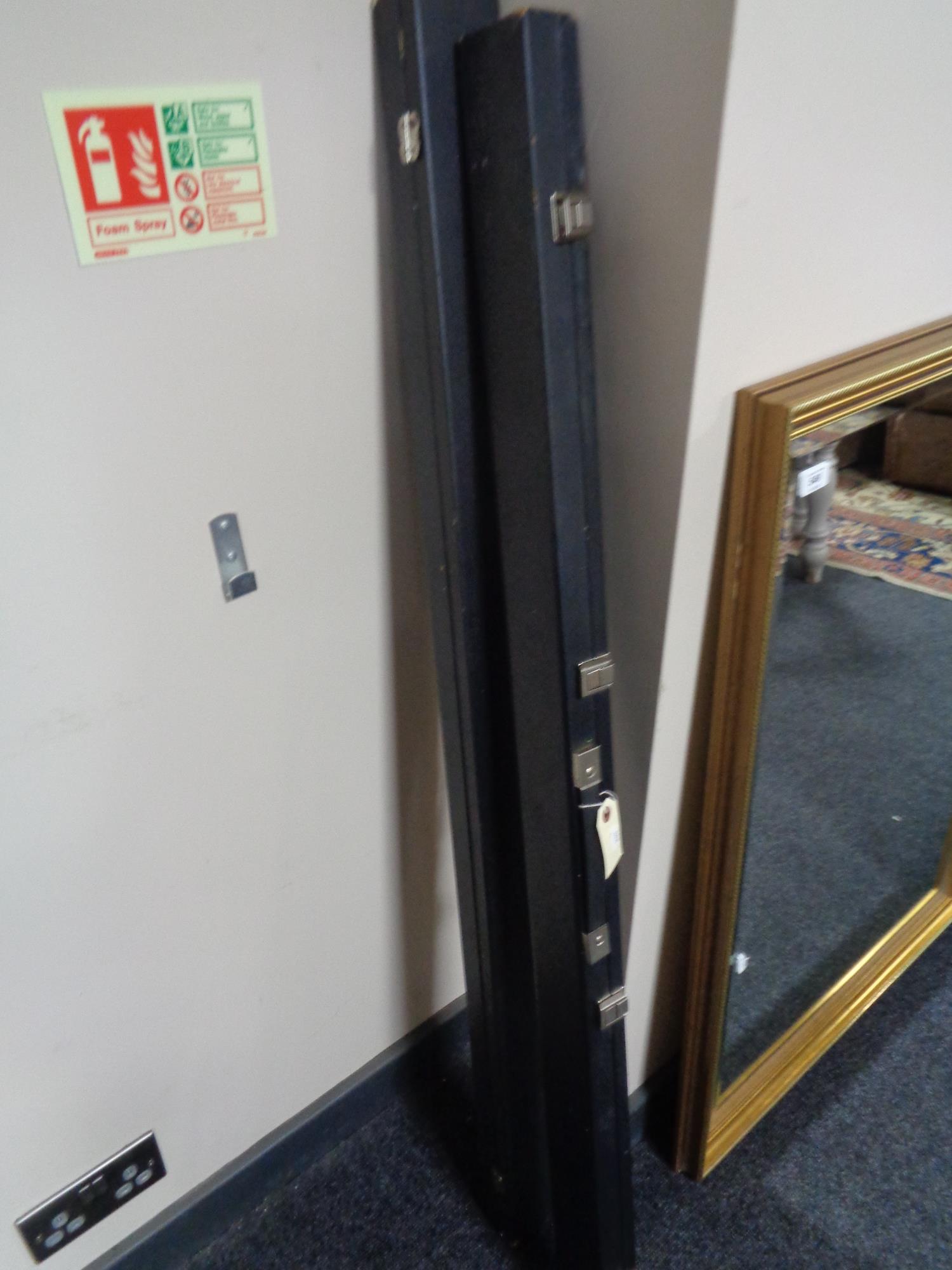 Two snooker cues in cases with extensions