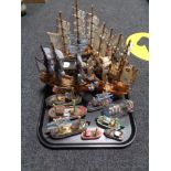 A tray of wooden boat ornaments,