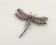 A fine sapphire, ruby and diamond brooch modelled as a dragonfly,