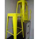 Two yellow metal bar stools with disconnected backs