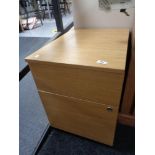 A beech two drawer filing chest