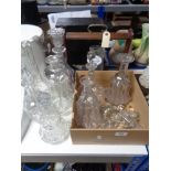A quantity of glass decanters and various stoppers