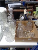 A quantity of glass decanters and various stoppers