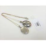 Two silver lockets on silver chains