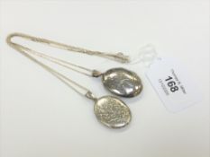 Two silver lockets on silver chains