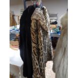 Two fur coats and a further faux leopard skin coat