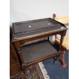 An early twentieth century mahogany trolley with tray