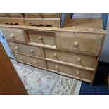 A pine multi drawer chest 148 cm x 78 cm x 49 cm