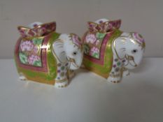 A pair of Royal Crown Derby Mother Indian Elephant paperweights with stoppers