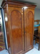 A Victorian mahogany double door wardrobe