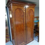 A Victorian mahogany double door wardrobe