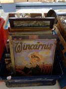 A box of metal advertising signs, decorative pictures,
