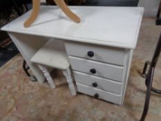 A painted white knee hole dressing table and stool