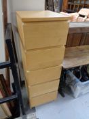 A beech five drawer narrow chest