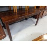 A hardwood extending pine dining room table
