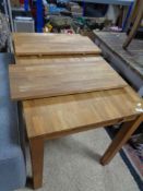 A contemporary hardwood extending dining table