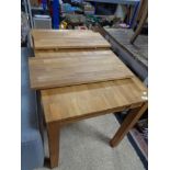 A contemporary hardwood extending dining table