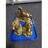 A tray of three brass horse figures