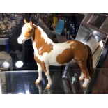 A Beswick gloss Pinto Pony, second version tail hanging loose,