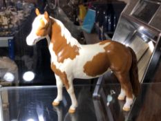 A Beswick gloss Pinto Pony, second version tail hanging loose,