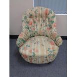 A Victorian lady's bedroom chair in floral button fabric