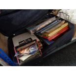 A suitcase of LP records and 45 RPM singles