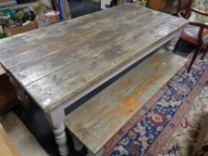 A reclaimed pine farmhouse table and bench set