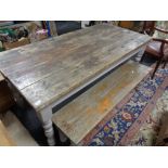 A reclaimed pine farmhouse table and bench set