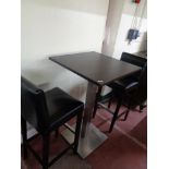 A single poser bar table together with a pair of black leather bar stools (3)