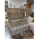 Three graduated wicker cases