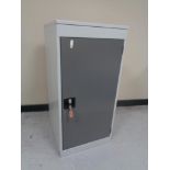A metal security locker with key