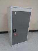 A metal security locker with key