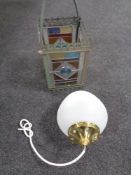 An antique metal gas hanging lamp with four stained glass panels together with a further light
