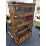 An Edwardian four tier oak stacking bookcase