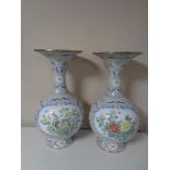 A pair of 20th century floral patterned enamel vases,