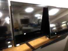 A Samsung 40" LCD TV (wall mounted no stand) and remote