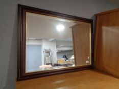 A contemporary bevelled wall mirror CONDITION REPORT: 88cm by 63cm.