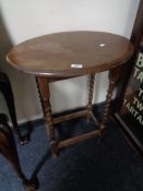 An Edwardian oak occasional table