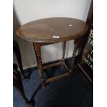 An Edwardian oak occasional table