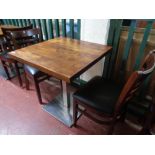 A cafe table together with a pair of wooden chairs (3)