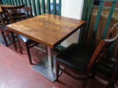 A cafe table together with a pair of wooden chairs (3)