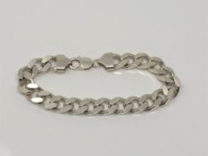 A heavy silver flat link bracelet, length 23cm CONDITION REPORT: 65.