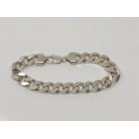 A heavy silver flat link bracelet, length 23cm CONDITION REPORT: 65.