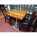 A cafe table together with a pair of wooden chairs (3)
