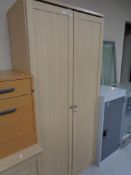 A beech double door office cabinet