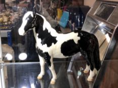 A Beswick gloss Pinto Pony, second version tail hanging loose,